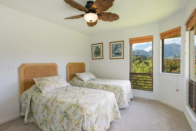 5451 Ka Haku Rd Unit 11, Princeville, HI 96722 - bedroom with carpet floors, a mountain view, a ceiling fan, and baseboards