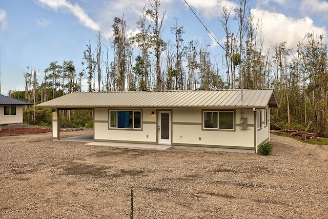 16-2119 Tangerine Dr, Pahoa, HI 96778 - single story home with metal roof, driveway, and a carport