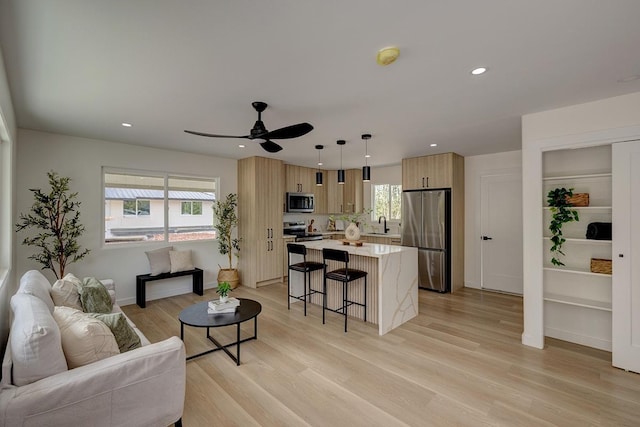 16-2119 Tangerine Dr, Pahoa, HI 96778 - living room featuring light wood-style floors, ceiling fan, recessed lighting, and baseboards