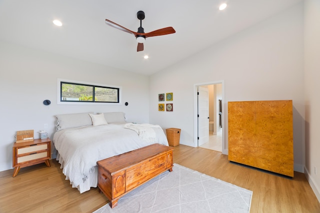 74-941 Kuni St, Kailua-Kona, HI 96740 - bedroom with light wood-style floors, recessed lighting, vaulted ceiling, baseboards, and ensuite bathroom