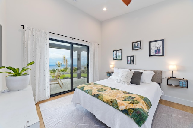 74-941 Kuni St, Kailua-Kona, HI 96740 - bedroom featuring access to exterior, light wood-style flooring, a towering ceiling, recessed lighting, and baseboards