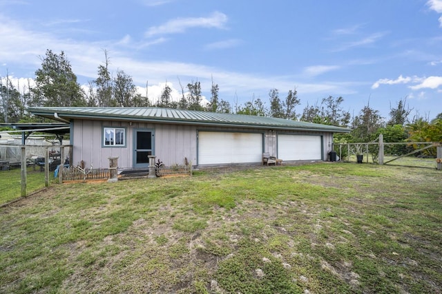 88-1650 Papio Dr, Captain Cook, HI 96704 - rear view of property with board and batten siding, a detached garage, and metal roof