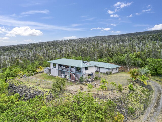 88-1650 Papio Dr, Captain Cook, HI 96704 - aerial view of property and surrounding area with a heavily wooded area