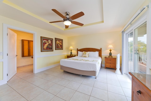 78-134 Holua Rd, Kailua-Kona, HI 96740 - bedroom with a raised ceiling, access to outside, light tile patterned floors, baseboards, and ensuite bath