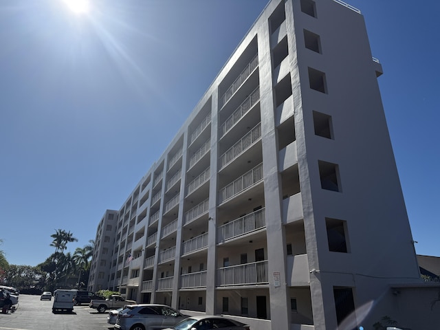 75-5766 Kuakini Hwy Unit 503, Kailua-Kona, HI 96740 - view of apartment building / complex featuring uncovered parking