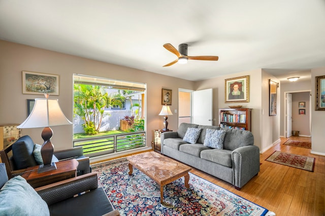 4911 Aliali Rd Unit 0002, Kapaa, HI 96746 - living area featuring ceiling fan, wood finished floors, and baseboards