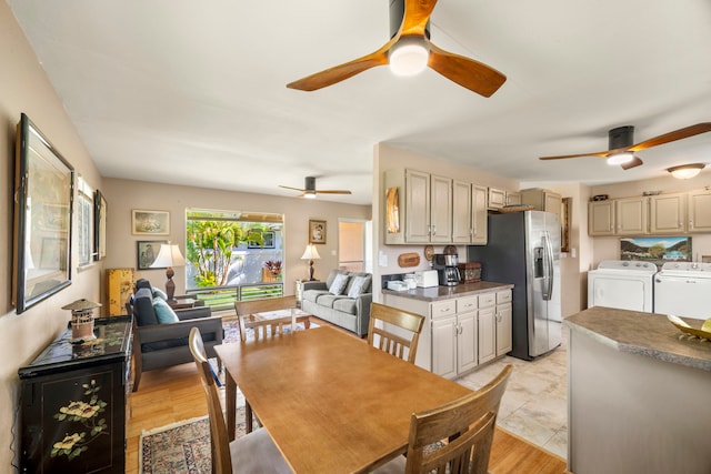 4911 Aliali Rd Unit 0002, Kapaa, HI 96746 - dining room with washing machine and clothes dryer, a ceiling fan, and light wood finished floors