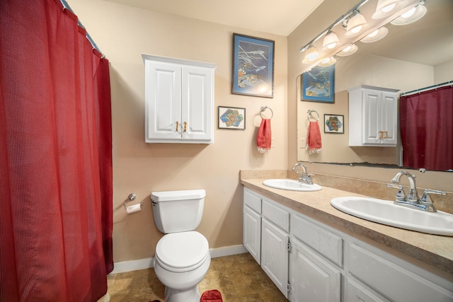 4911 Aliali Rd Unit 0002, Kapaa, HI 96746 - bathroom with double vanity, toilet, baseboards, and curtained shower