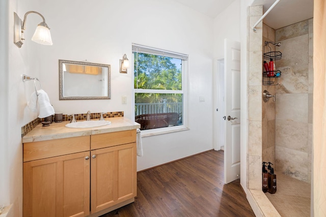 71-1410 Puu Kamanu Ln, Kailua-Kona, HI 96740 - full bathroom featuring wood finished floors, tiled shower, and vanity