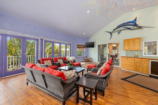 71-1410 Puu Kamanu Ln, Kailua-Kona, HI 96740 - living room with beverage cooler, wood finished floors, french doors, plenty of natural light, and high vaulted ceiling