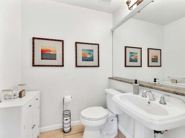 68-1125 Kaniku Dr Unit 2105, Kamuela, HI 96743 - bathroom with toilet, tile patterned floors, a sink, and baseboards