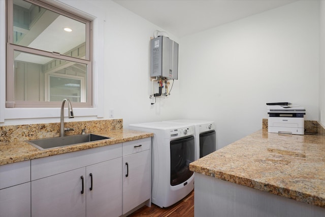 67-1027 Wainoenoe Rd, Kamuela, HI 96743 - laundry area featuring tankless water heater, washing machine and clothes dryer, and dark wood finished floors