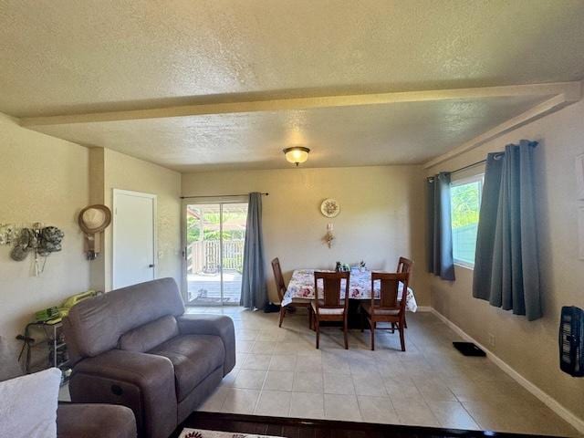 15-2690 Mahimahi St, Pahoa, HI 96778 - dining space featuring plenty of natural light, a textured ceiling, baseboards, and light tile patterned flooring