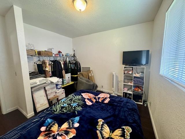 15-2690 Mahimahi St, Pahoa, HI 96778 - bedroom with baseboards and a textured ceiling