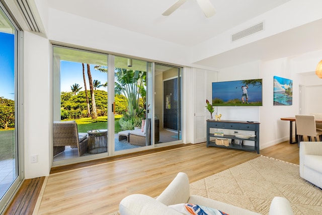 69-1010 Keana Pl Unit B106, Waikoloa, HI 96738 - living area with wood finished floors and a ceiling fan