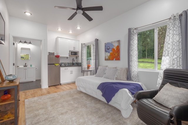 36-574 Spencer Rd, Laupahoehoe, HI 96764 - bedroom featuring freestanding refrigerator, light wood-type flooring, a sink, ceiling fan, and recessed lighting