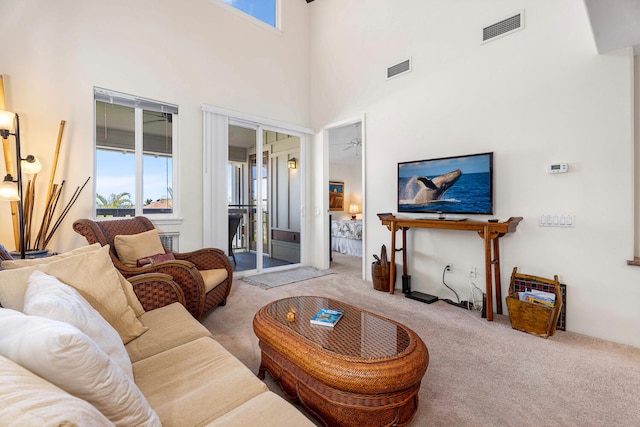 75-5919 Alii Dr Unit U23, Kailua-Kona, HI 96740 - carpeted living room featuring a towering ceiling
