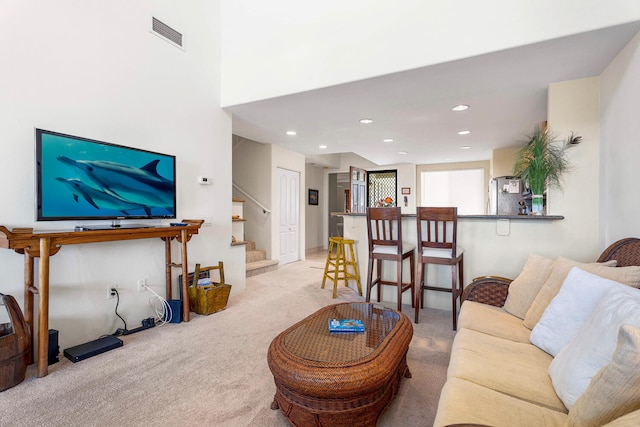 75-5919 Alii Dr Unit U23, Kailua-Kona, HI 96740 - living room with light carpet, stairway, and recessed lighting
