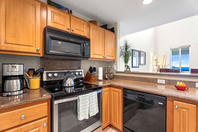 75-5919 Alii Dr Unit U23, Kailua-Kona, HI 96740 - kitchen featuring black appliances and dark stone counters