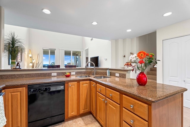 75-5919 Alii Dr Unit U23, Kailua-Kona, HI 96740 - kitchen featuring black dishwasher, a sink, dark stone counters, recessed lighting, and brown cabinets