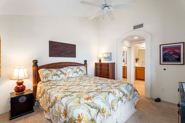 75-5919 Alii Dr Unit U23, Kailua-Kona, HI 96740 - bedroom featuring light carpet, arched walkways, lofted ceiling, ensuite bathroom, and ceiling fan