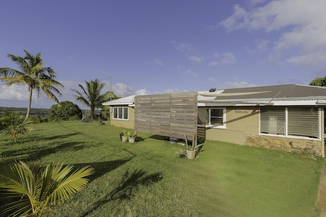 5114 Annie Rd Unit 1, Kapaa, HI 96746 - view of side of home featuring a lawn