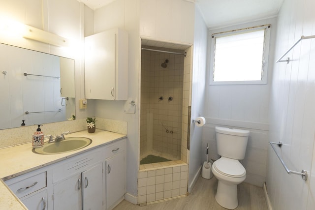 5114 Annie Rd Unit 1, Kapaa, HI 96746 - bathroom with vanity, toilet, tiled shower, and wood finished floors