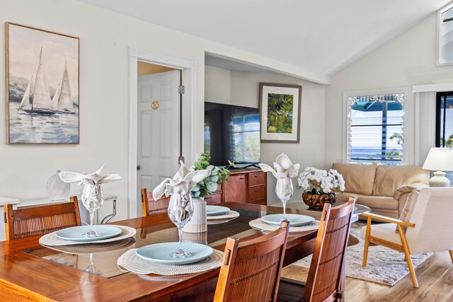 76-6302 Leone St, Kailua-Kona, HI 96740 - dining space featuring vaulted ceiling and wood finished floors