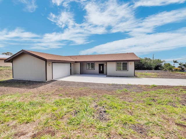 94-1679 Kaulua St, Naalehu, HI 96772 - ranch-style house with an attached garage, concrete driveway, and a patio
