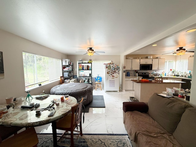 18-7862 N Lauko Rd, Mountain View, HI 96771 - living area with a ceiling fan and light marble finish floors