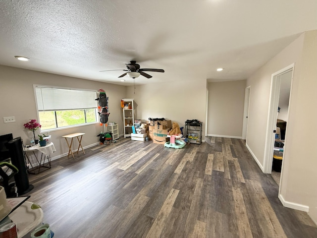 18-7862 N Lauko Rd, Mountain View, HI 96771 - living room with dark wood-style flooring, ceiling fan, baseboards, and recessed lighting