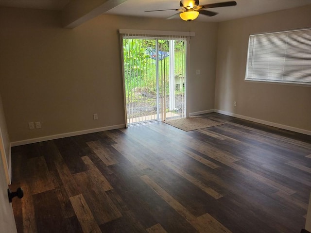 18-7862 N Lauko Rd, Mountain View, HI 96771 - empty room with a ceiling fan, dark wood-style flooring, and baseboards