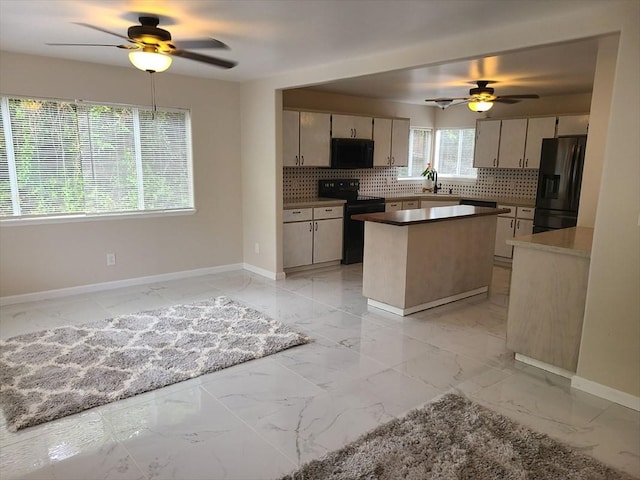 18-7862 N Lauko Rd, Mountain View, HI 96771 - kitchen with black appliances, a ceiling fan, light marble finish flooring, decorative backsplash, and baseboards
