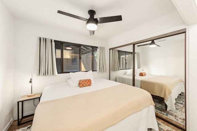 73-1099 Oluolu St, Kailua-Kona, HI 96740 - bedroom featuring wood finished floors, a ceiling fan, a closet, and baseboards