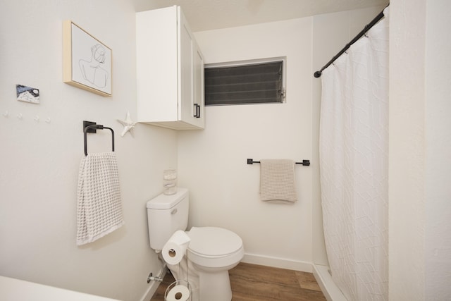 73-1099 Oluolu St, Kailua-Kona, HI 96740 - bathroom with wood finished floors, baseboards, toilet, and a shower with shower curtain