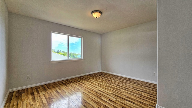 94-6663 Kamaoa Rd, Naalehu, HI 96772 - unfurnished room featuring wood finished floors and baseboards