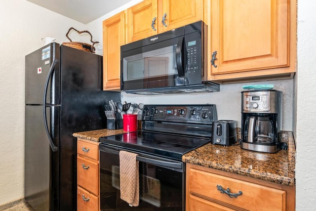 75-5888 Alii Dr Unit A4, Kailua-Kona, HI 96740 - kitchen with black appliances and dark stone counters