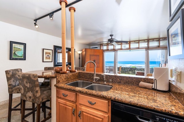 75-5888 Alii Dr Unit A4, Kailua-Kona, HI 96740 - kitchen featuring a sink, dishwasher, a ceiling fan, dark stone countertops, and brown cabinetry