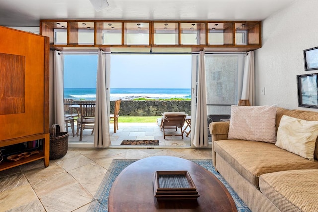 75-5888 Alii Dr Unit A4, Kailua-Kona, HI 96740 - living area with a textured wall, a water view, and tile patterned flooring