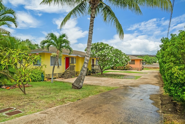 4720 Menehune Rd, Waimea, HI 96796 - view of front of property with driveway, a front lawn, and roof with shingles