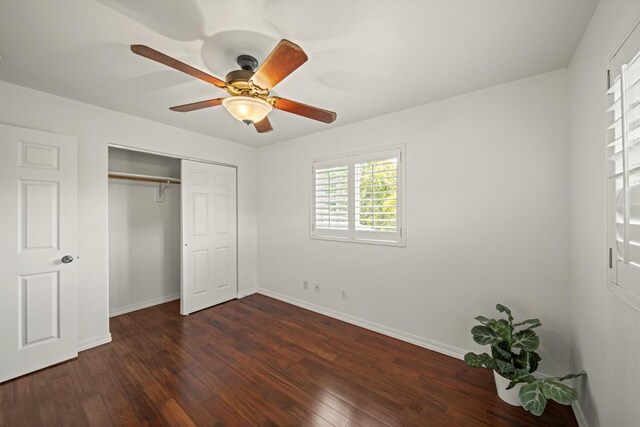 15-1663 Beach Rd, Keaau, HI 96749 - unfurnished bedroom with baseboards, dark wood-style flooring, a closet, and ceiling fan