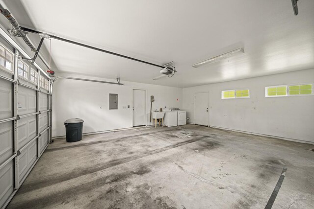 15-1663 Beach Rd, Keaau, HI 96749 - garage with electric panel, a garage door opener, independent washer and dryer, and a sink