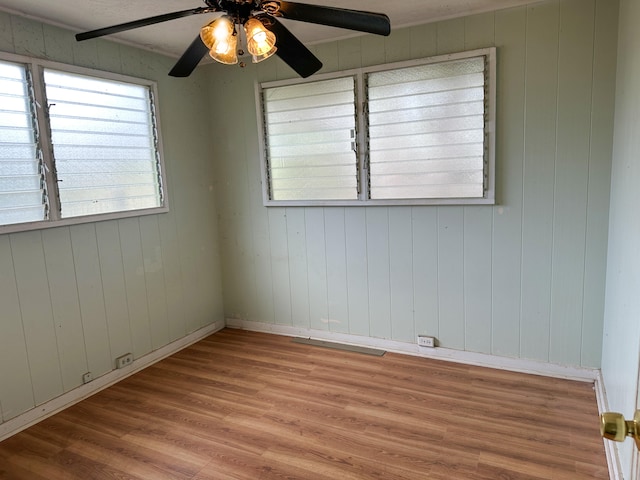 4854 Aliali Rd, Kapaa, HI 96746 - spare room featuring wood finished floors, ceiling fan, and baseboards