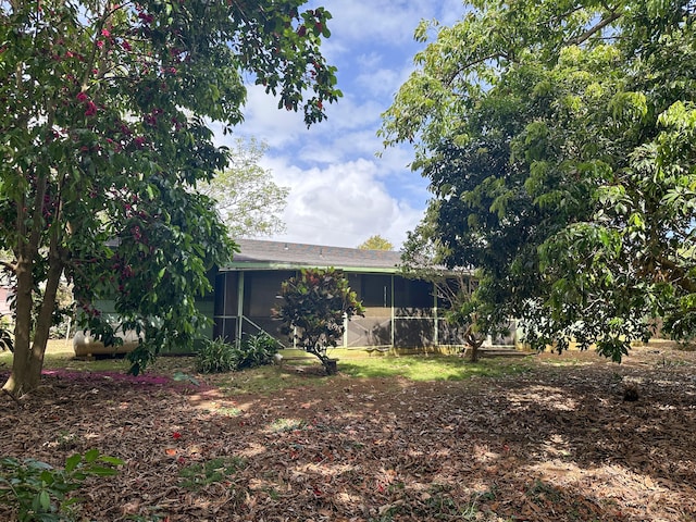 4854 Aliali Rd, Kapaa, HI 96746 - rear view of property with a sunroom