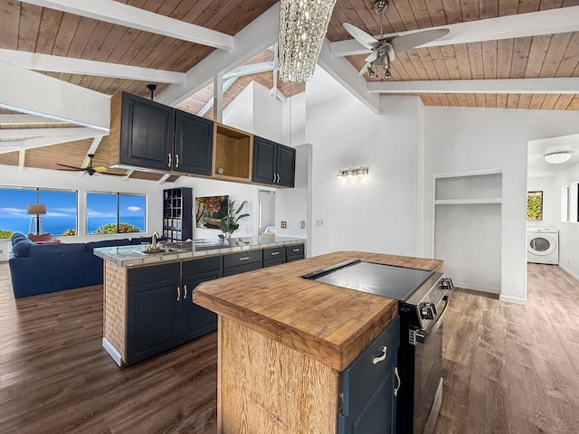 87-2814 Hawaii Belt Rd, Captain Cook, HI 96704 - kitchen with washer / clothes dryer, ceiling fan, wooden ceiling with exposed beams, range with electric stovetop, and a kitchen island