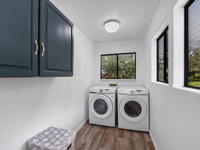 87-2814 Hawaii Belt Rd, Captain Cook, HI 96704 - laundry room with washing machine and clothes dryer, baseboards, cabinet space, and dark wood-type flooring