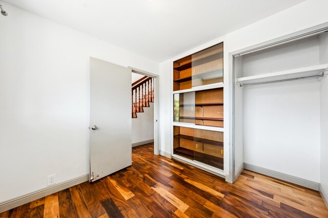 2969 Aloalo Pl, Lihue, HI 96766 - unfurnished bedroom with wood finished floors, a closet, and baseboards