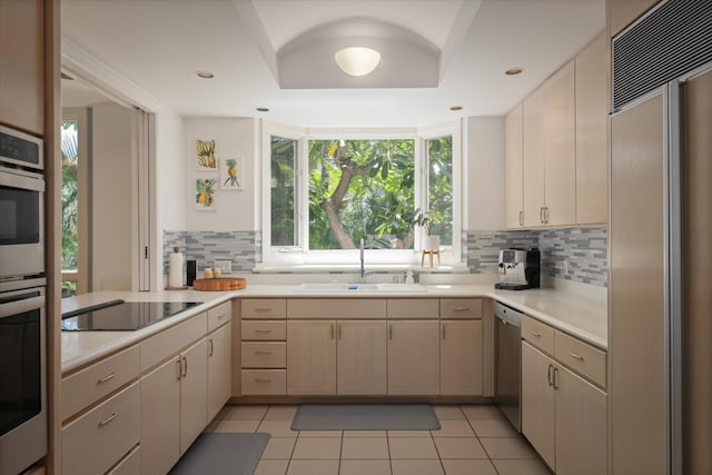 68-1375 Pauoa Rd Unit M4, Kamuela, HI 96743 - kitchen featuring paneled refrigerator, a sink, black electric stovetop, dishwasher, and tasteful backsplash