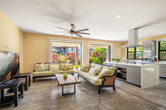 1647 Kelaukia St, Koloa, HI 96756 - living room featuring finished concrete floors, ceiling fan, and recessed lighting