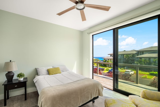 1647 Kelaukia St, Koloa, HI 96756 - bedroom featuring access to exterior, baseboards, ceiling fan, and wood finished floors